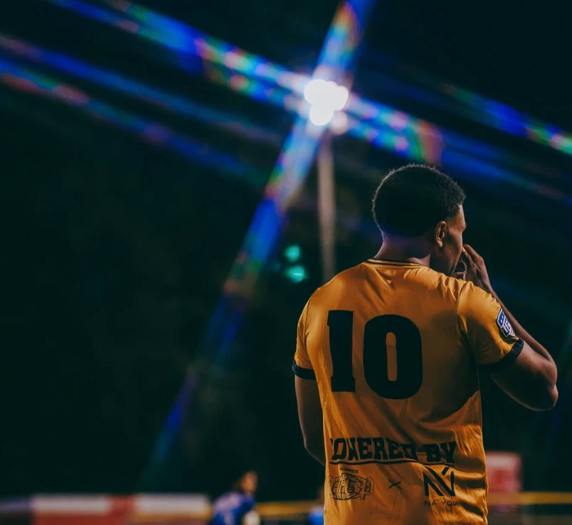 AUFC number 10 in the gold kit with sponsor branding on the back